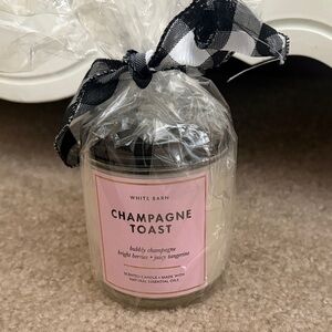 White Barn Champagne Toast Candle with Pink Label